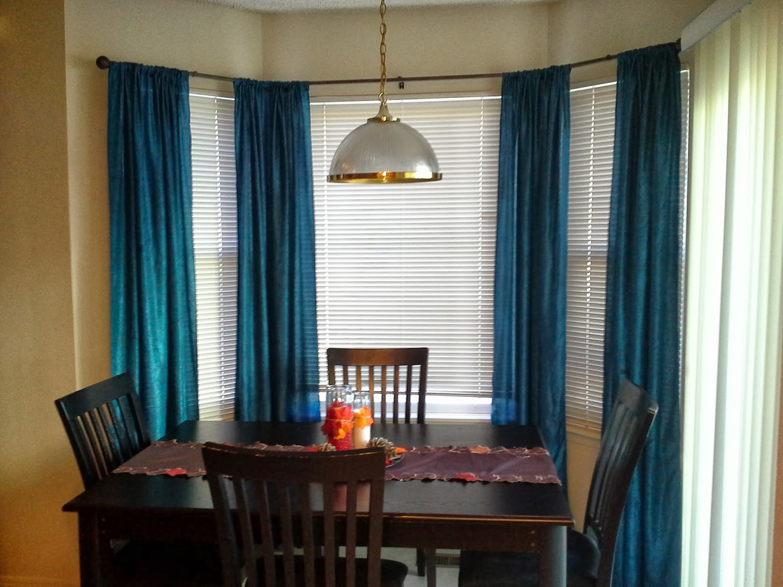 dining room with blue curtains